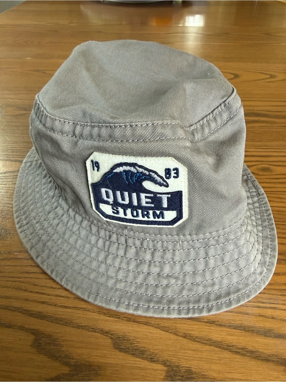 Quiet Storm Legacy Gray Bucket Hat with blue/white logo L/XL